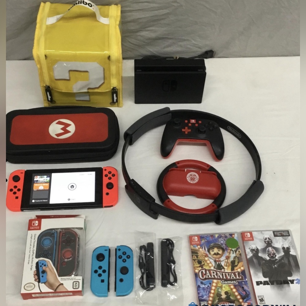 Full Nintendo Switch Bundle. 4 JoyCons, 2 games, dock, cords, & MORE